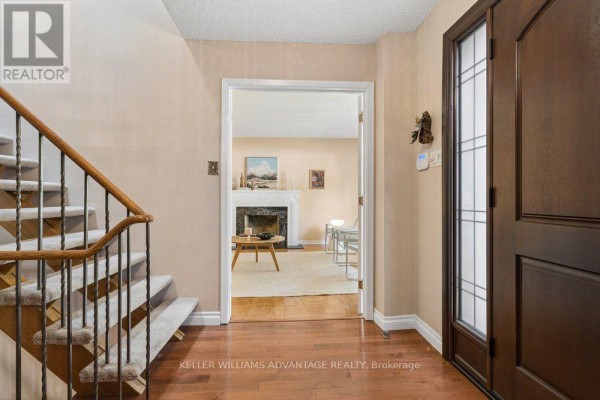 Laundry room with white cabinetry, stainless steel washer and dryer, and sink. - 2192 Castlestone Court, Mississauga