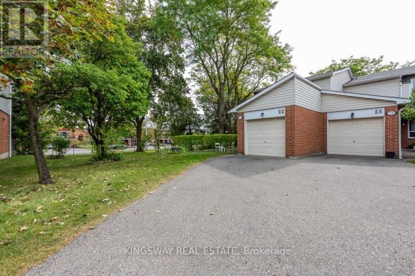 Driveway leading to the exterior of townhouse 22 and 25 with attached garages. - 22 - 525 Meadows Boulevard, Mississauga