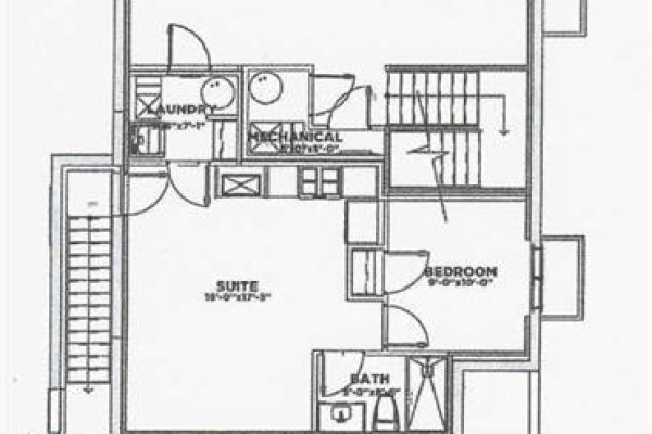 Lower floor layout showing suite, bedroom, and bathroom areas. - 22 Greenwich Row Nw, Calgary