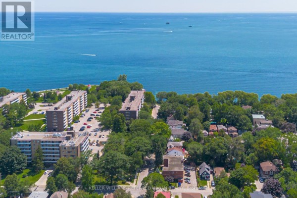 Aerial view of buildings and Lake Ontario shoreline. - 22 Long Branch Avenue, Toronto