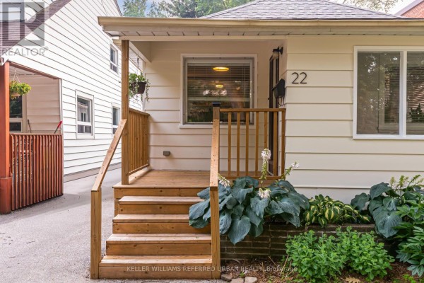 Close-up of the wooden porch and steps of a bungalow. - 22 Long Branch Avenue, Toronto