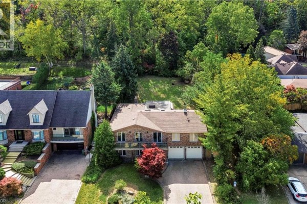 Aerial view of the house at 22 Oakridge Drive, Stoney Creek, surrounded by trees. - 22 Oakridge Drive, Stoney Creek