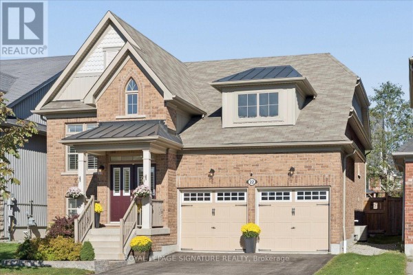 Front exterior view of a two-story brick house with a dormer window. - 22 Wycombe Street, Whitby