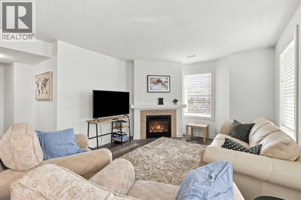 Living room - 220, 50 Westland Road, Okotoks, AB T1S2G4 Photo 3