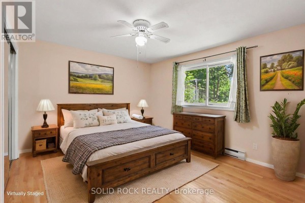 Sunroom with large windows and chairs - 220 Highfield Crescent Beckwith