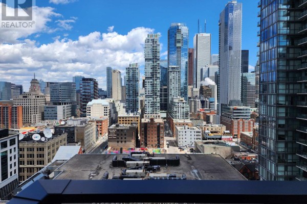 View of Toronto skyline and buildings from a high floor. - 2201 - 38 Widmer Street, Toronto
