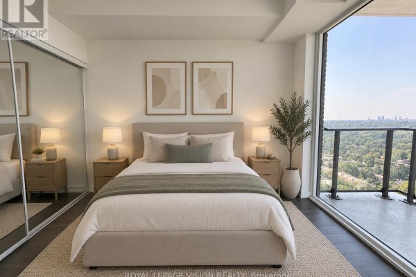 Bedroom with a queen-sized bed, nightstands, mirrored closet, and large window. - 2201 - 4010 Eglinton Avenue W, Toronto