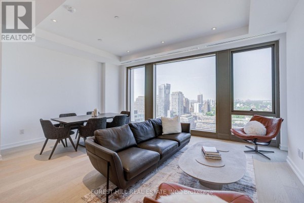 Entrance to 1315 Bay Street with double glass doors and paved walkway. - 2202 - 1315 Bay Street, Toronto