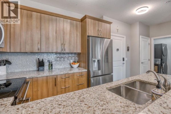 Laundry room - 2203, 15 Sunset Square, Cochrane, AB T4C0E7 Photo 5