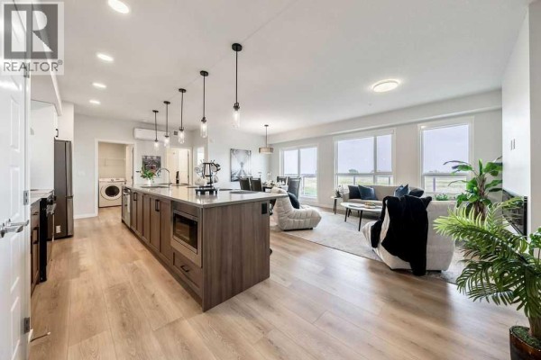 Living room - 2205, 550 Belmont Street Sw, Calgary, AB T2X6A5 Photo 3