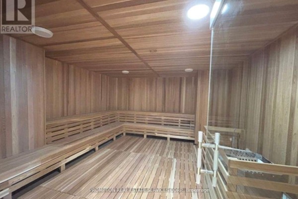 Spacious wood-paneled sauna with tiered benches and integrated heating element. - 2207 - 1 Concord Cityplace Way, Toronto