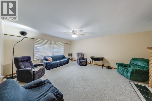 Living room with light beige carpet, windows, ceiling fan, and multiple pieces of upholstered furniture. - 221 Second Avenue, Rivervale