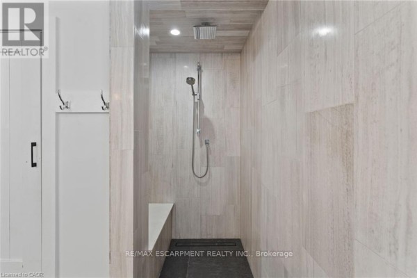 Modern walk-in shower with rainfall shower head and bench - 2210 Highway 54 Haldimand