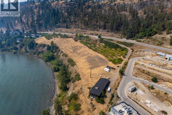 Aerial perspective of the undeveloped land, existing building, and road network. - 2211 Campbell Road, West Kelowna