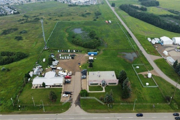 Aerial view of the commercial property, showing buildings, parking lots, and open green space. - 2220 Broadmoor Bv, Sherwood Park