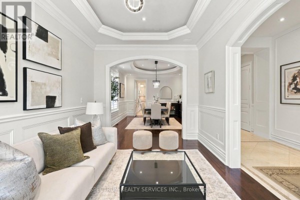 Close-up of grand piano in a well-lit room with plantation shutters and artwork - 223 Lennox Avenue, Richmond Hill