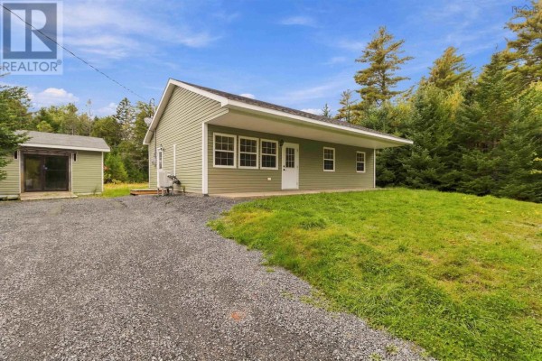 Front view of the light green bungalow with a covered porch and white trim. - 2247 Camperdown Road, Lapland