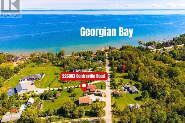 Aerial view of 226083 Centreville Road with Georgian Bay in the background. - 226083 Centreville Road, Meaford