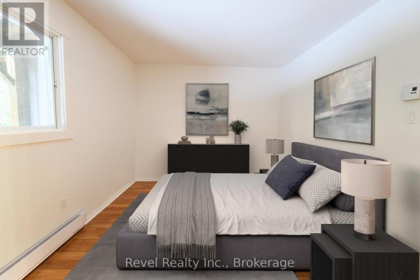 Living area with hardwood flooring, pendant lighting, and sliding glass door - 227 - 17 Harbour Street W, Collingwood