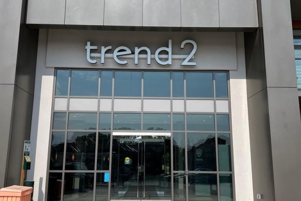 Building entrance with glass doors and "trend 2" signage above. - 227 - 460 Dundas Street E, Hamilton