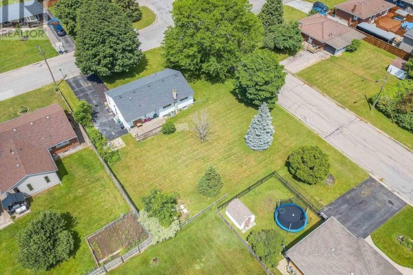 Aerial perspective of a suburban neighborhood with homes, yards, and paved streets. - 23 & 29 Dexter Drive, Welland