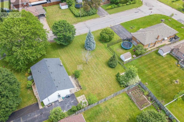 Wide aerial shot of residential properties and green spaces on a sunny day. - 23 & 29 Dexter Drive, Welland