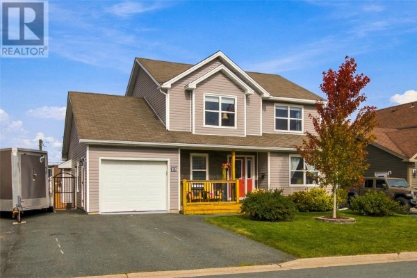 Front exterior view of a two-story house with grey siding, a red front door, and a garage. - 23 Hollyberry Drive, Paradise
