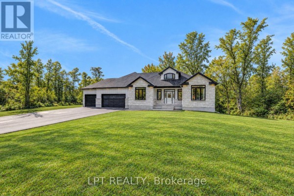 Bright entryway with double doors, large windows, and tiled flooring. - 23 Skeel Court, Ottawa