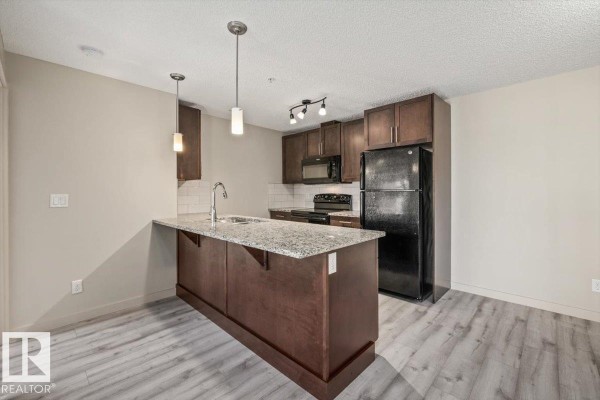 Kitchen - #230 6076 Schonsee Wy Nw, Edmonton, AB T5Z0K8 Photo 3