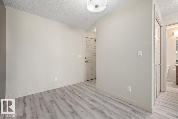 Bedroom 2 - #230 6076 Schonsee Wy Nw, Edmonton, AB T5Z0K8 Photo 5