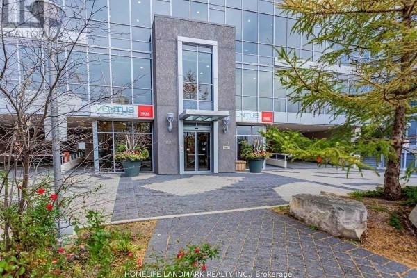 Building entrance with glass doors, planters, and signage for Ventus and a condominium number. - 2306 - 151 Village Green Square, Toronto