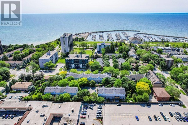 Aerial view of the area showing proximity to the waterfront and green spaces. - 2307 - 2309 Lakeshore Road W, Oakville