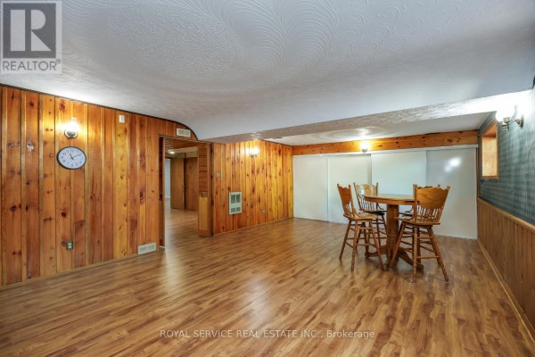 Wood paneled basement with dining table and chairs - 2311 Division Street N Hamilton Township