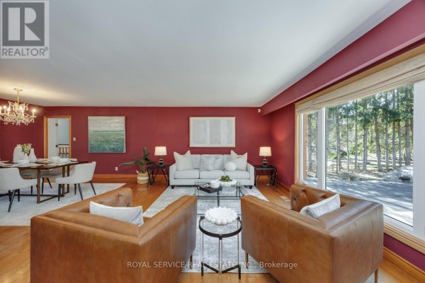 Living room with sofa, armchairs, and dining area - 2311 Division Street N Hamilton Township