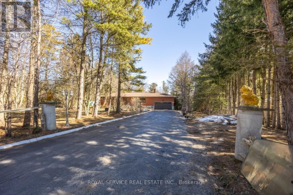 Brick house with driveway, garage, and lion statues - 2311 Division Street N Hamilton Township