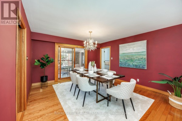 Dining room with table set, chandelier, and sliding glass door - 2311 Division Street N Hamilton Township