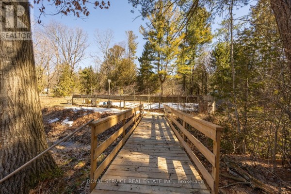 Wooden bridge and yard with trees and fencing - 2311 Division Street N Hamilton Township