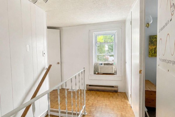 Hallway with parquet floor and white railings - 232 Regent Street Hawkesbury