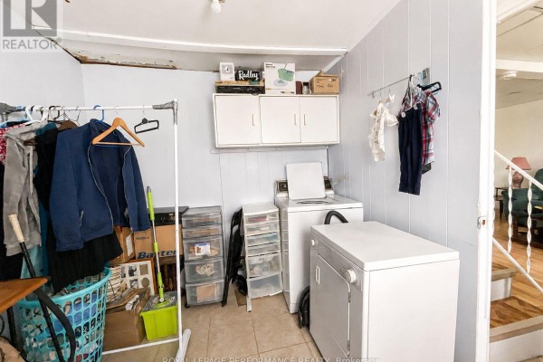 Laundry room with washer, dryer, and storage - 232 Regent Street Hawkesbury