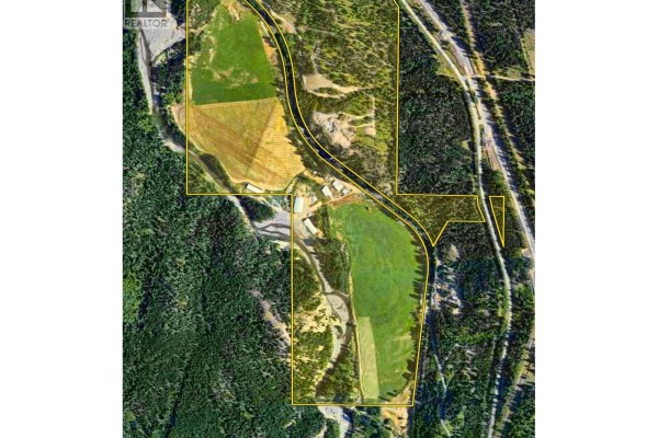 Aerial drone map view of the 2321 Peterson Road property with farm buildings and land. - 2321 Peterson Road, Merritt
