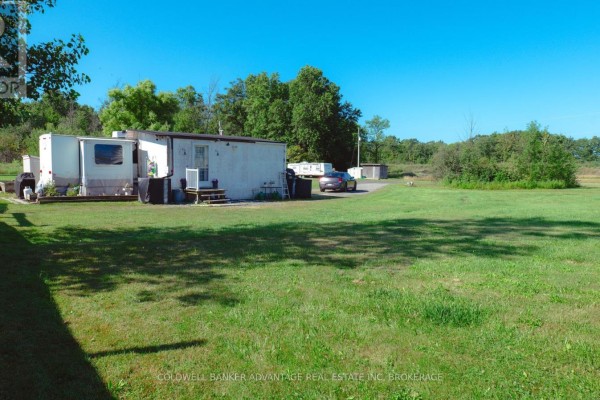 View of trailers and surrounding green space at 2323 Kottmeier Road. - 2323 Kottmeier Road, Thorold
