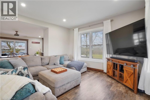 Large sectional sofa and TV in living room - 23247 Beattie Drive Elgin