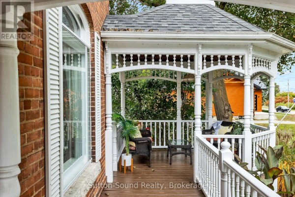 View from the porch looking out at the gazebo with outdoor seating. - 2344 3rd Avenue, Owen Sound