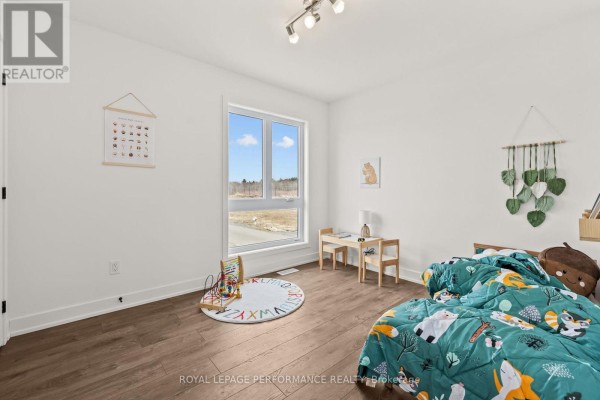 Bedroom with woodland theme bedding and desk - 235 Bourdeau Boulevard The Nation