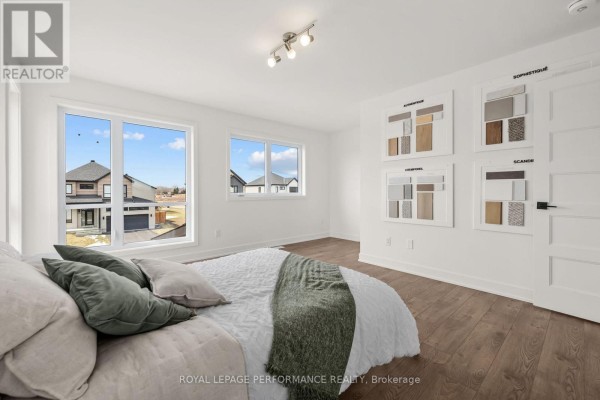 Bedroom with large windows and design samples - 235 Bourdeau Boulevard The Nation