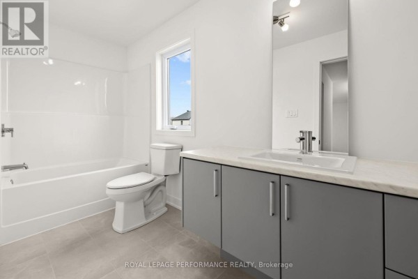 Bathroom with bathtub, toilet, vanity, mirror - 235 Bourdeau Boulevard The Nation