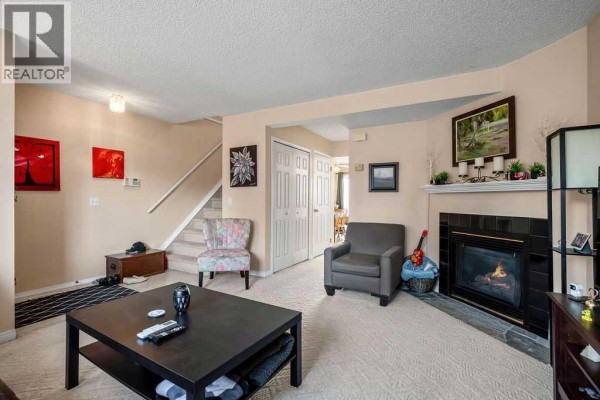 Living room - 237 Mt Aberdeen Circle Se, Calgary, AB T2Z2V5 Photo 3