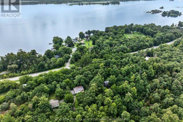 Waterfront property with tree-lined lot and multiple buildings - 237 Old River Road Leeds And The Thousand Islands