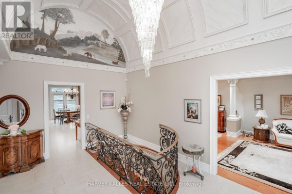 Upper view of the foyer highlighting a mural and access to living areas. - 2370 Hammond Road, Mississauga