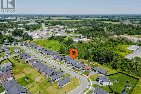 Aerial view of a modern suburban neighborhood with new construction homes and green yards - 2389 Watson Crescent Cornwall